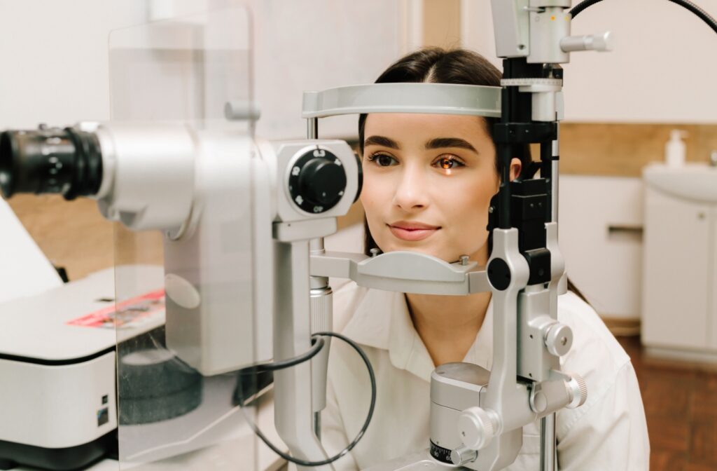 A person having their eyes examined as part of preventative health care to catch eye disease and damage before outward signs arise.